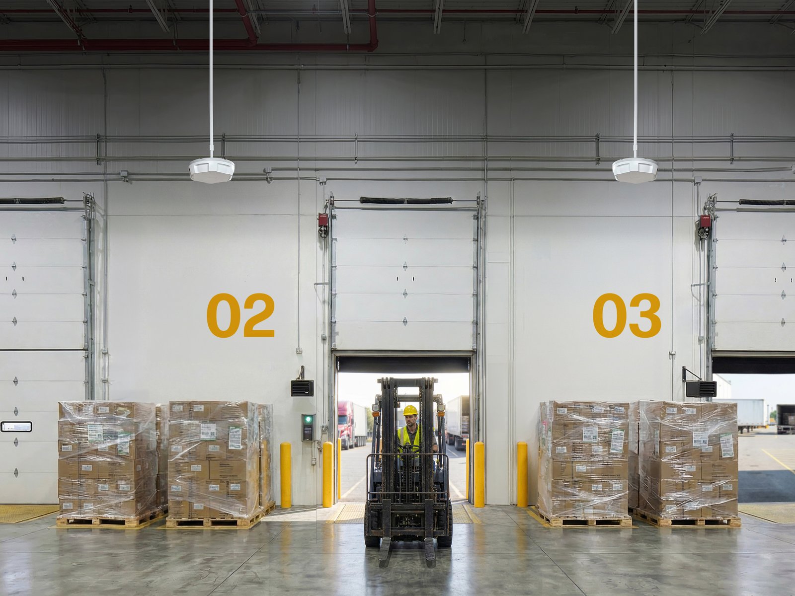 Zebra ATR7000 readers hung between two warehouse dock doors